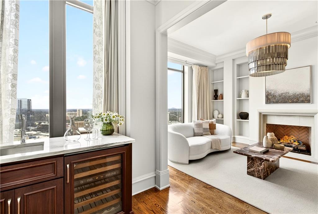 3376 Peachtree Road Northeast, Unit 41A Atlanta, GA 30326 - Photo 17 of 76 a living room with furniture and a fireplace