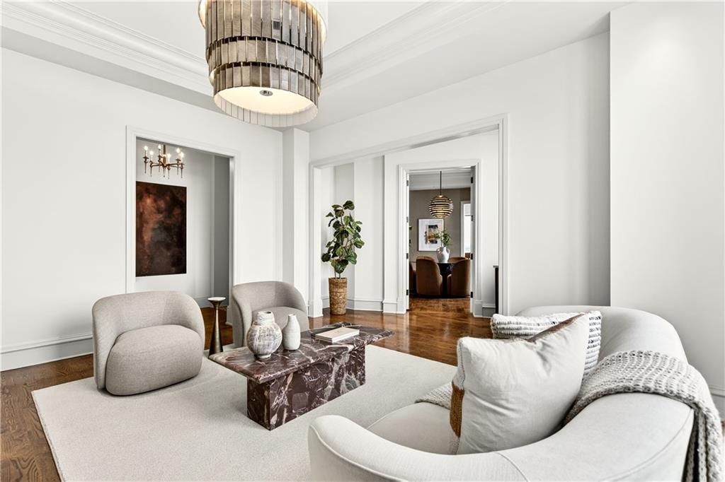 3376 Peachtree Road Northeast, Unit 41A Atlanta, GA 30326 - Photo 20 of 76 a living room with furniture flowerpot and a chandelier