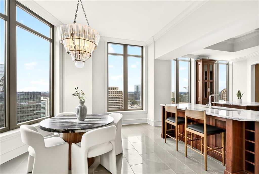 3376 Peachtree Road Northeast, Unit 41A Atlanta, GA 30326 - Photo 23 of 76 a view of a dining room with furniture window and outside view