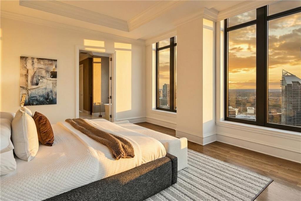 3376 Peachtree Road Northeast, Unit 41A Atlanta, GA 30326 - Photo 3 of 76 a bedroom with a bed and a large window