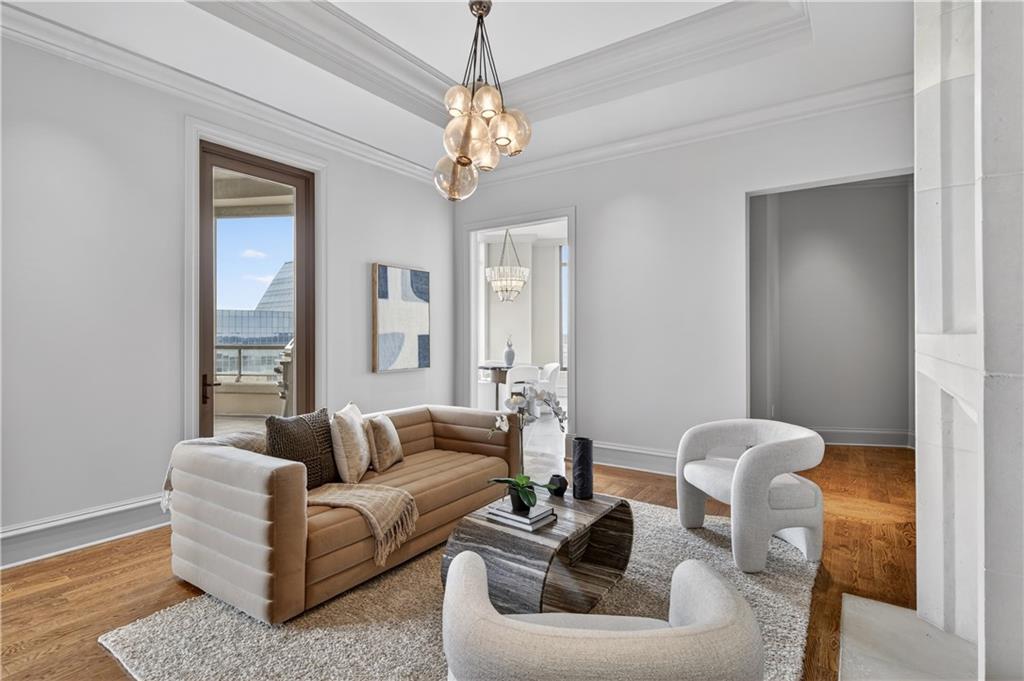 3376 Peachtree Road Northeast, Unit 41A Atlanta, GA 30326 - Photo 33 of 76 a living room with furniture and a chandelier