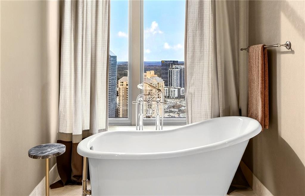 3376 Peachtree Road Northeast, Unit 41A Atlanta, GA 30326 - Photo 38 of 76 a white bath tub sitting next to a window