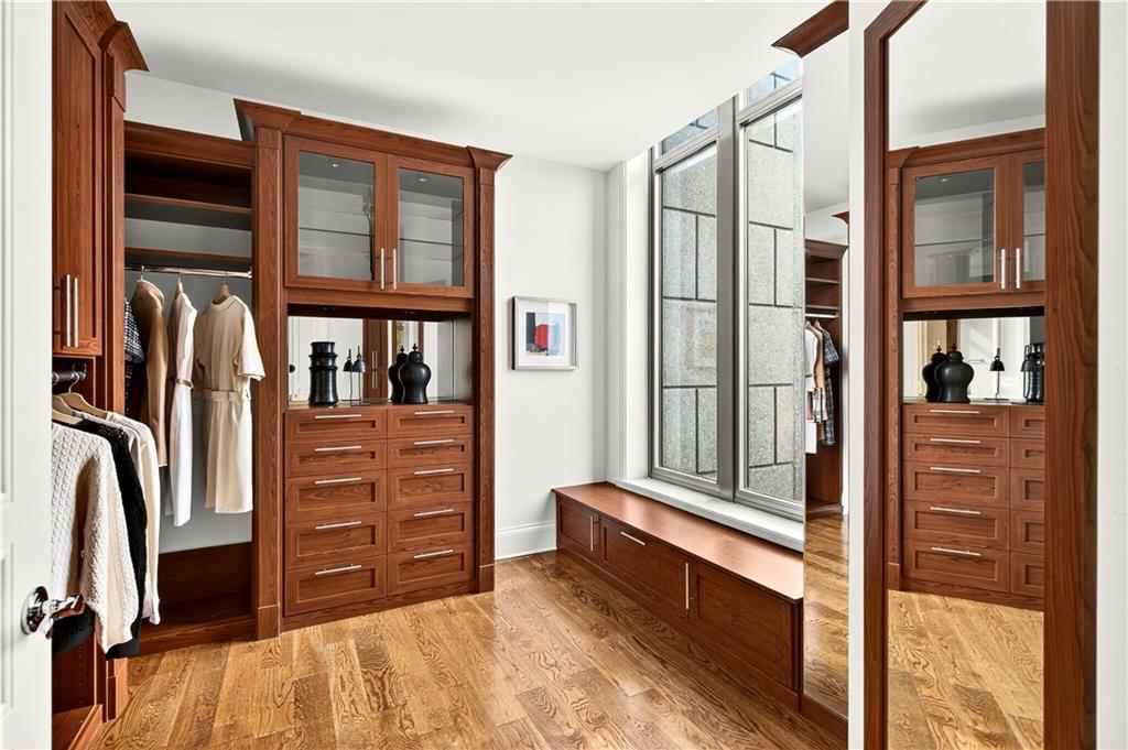 3376 Peachtree Road Northeast, Unit 41A Atlanta, GA 30326 - Photo 44 of 76 a view of walk in closet with clothes