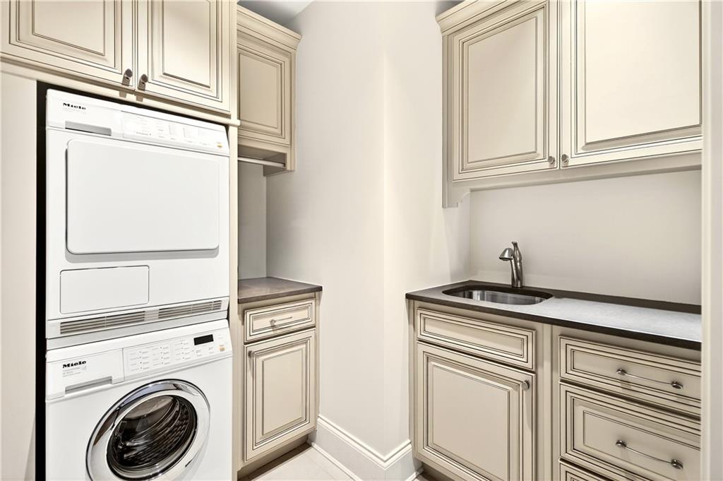 3376 Peachtree Road Northeast, Unit 41A Atlanta, GA 30326 - Photo 55 of 76 a view of a kitchen with stainless steel appliances granite countertop cabinets and a stove
