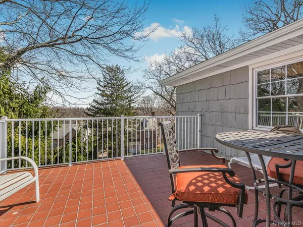 a view of a patio with a table and chairs