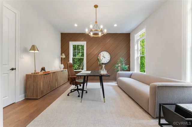 a bathroom with a window sink and mirror