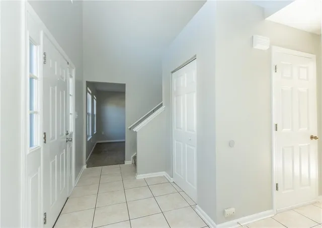 a view of a hallway with a bathroom