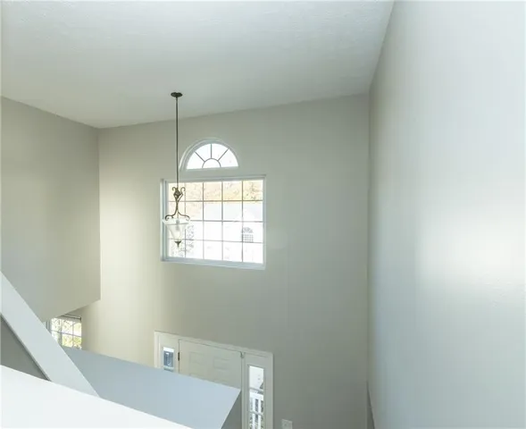 a bathroom with a sink window and a mirror