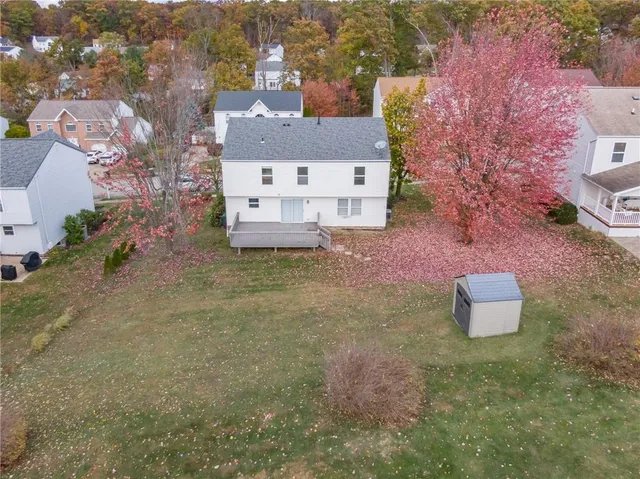 an aerial view of a house with outdoor space