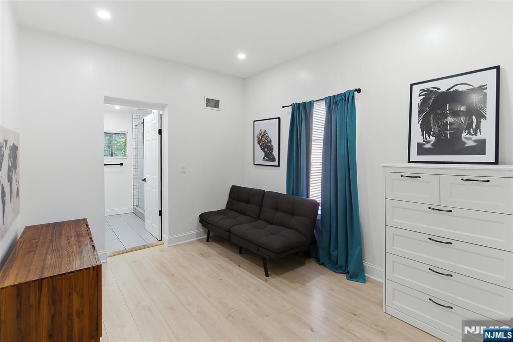 22 8th Avenue Newark, NJ 07104 - Photo 19 of 26 a living room with furniture and a flat screen tv