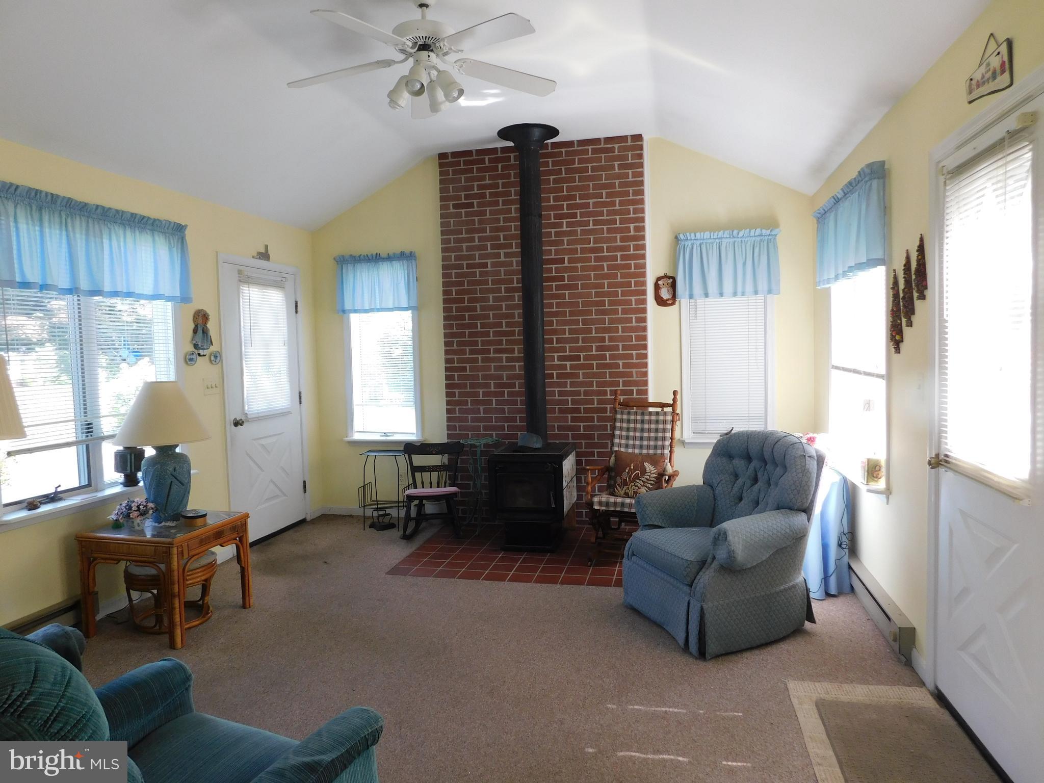 204 Highland Road Bel Air, MD 21014 - Photo 13 of 25 Sun Room View of Front Door and Wood Stove