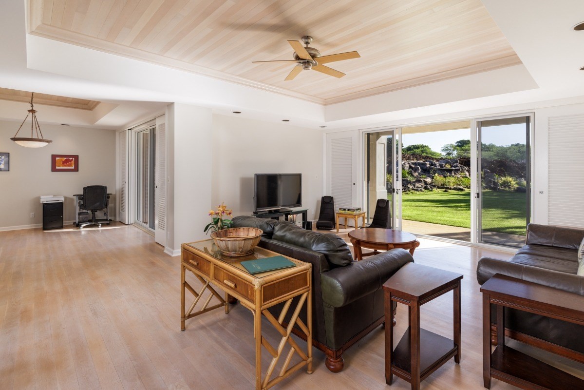 68-1375 Pauoa Road, Unit M2 Kamuela, HI 96743 - Photo 11 of 26 a living room with furniture and a flat screen tv