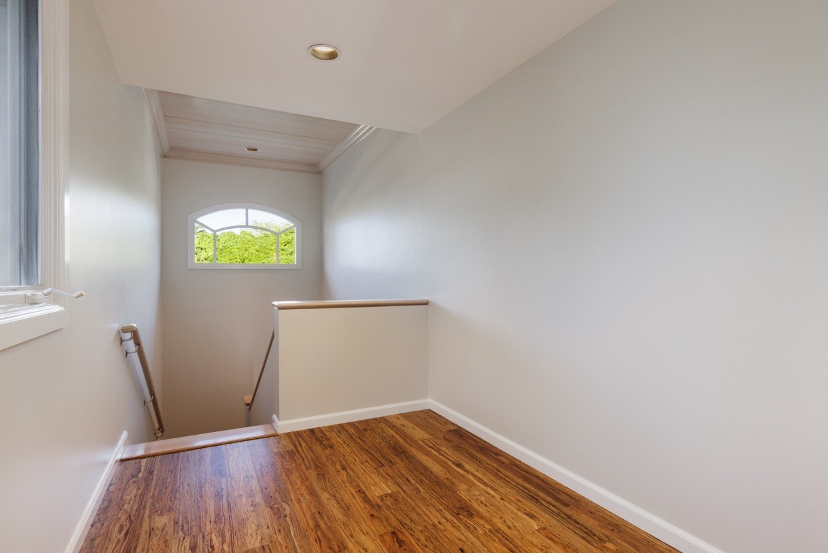 68-1375 Pauoa Road, Unit M2 Kamuela, HI 96743 - Photo 12 of 26 a view of an empty room and wooden floor