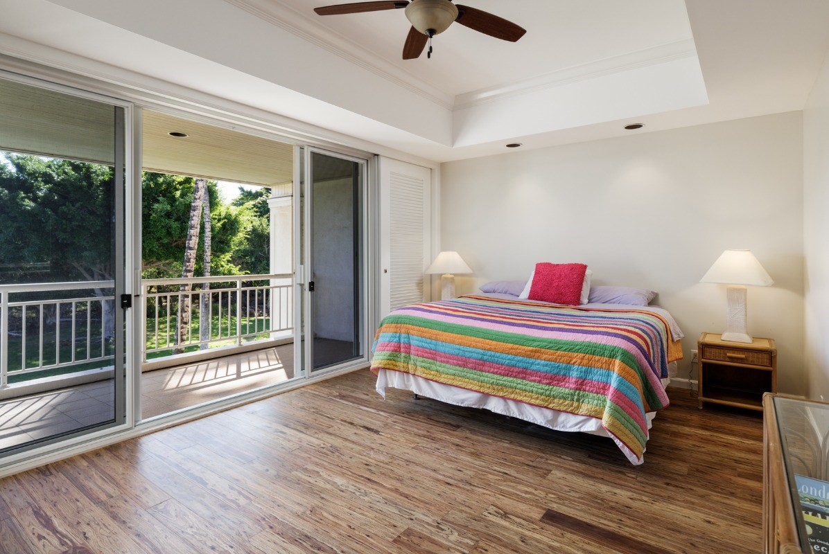 68-1375 Pauoa Road, Unit M2 Kamuela, HI 96743 - Photo 13 of 26 a bedroom with a bed and wooden floor