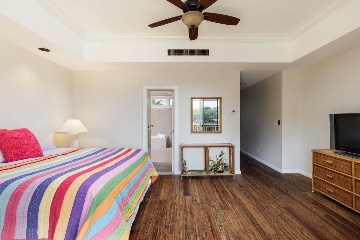 68-1375 Pauoa Road, Unit M2 Kamuela, HI 96743 - Photo 14 of 26 a bedroom with bed and wooden floor