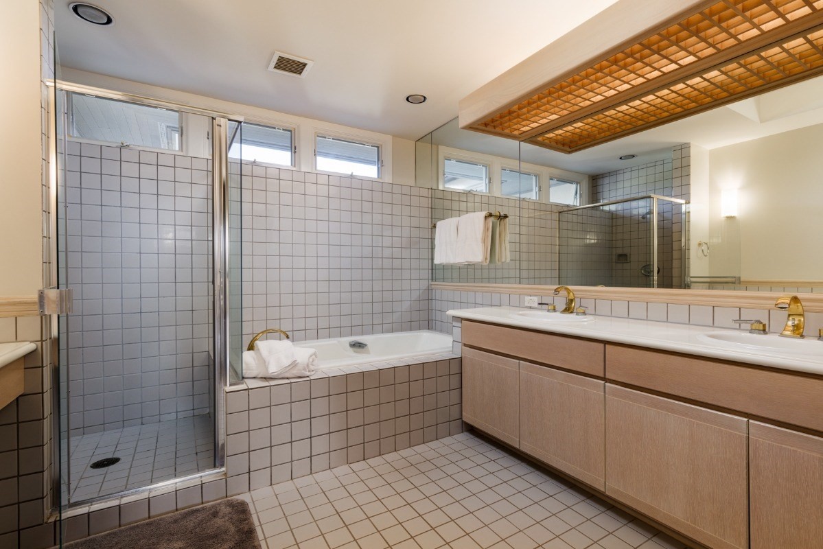 68-1375 Pauoa Road, Unit M2 Kamuela, HI 96743 - Photo 19 of 26 a bathroom with a double vanity sink mirror and shower