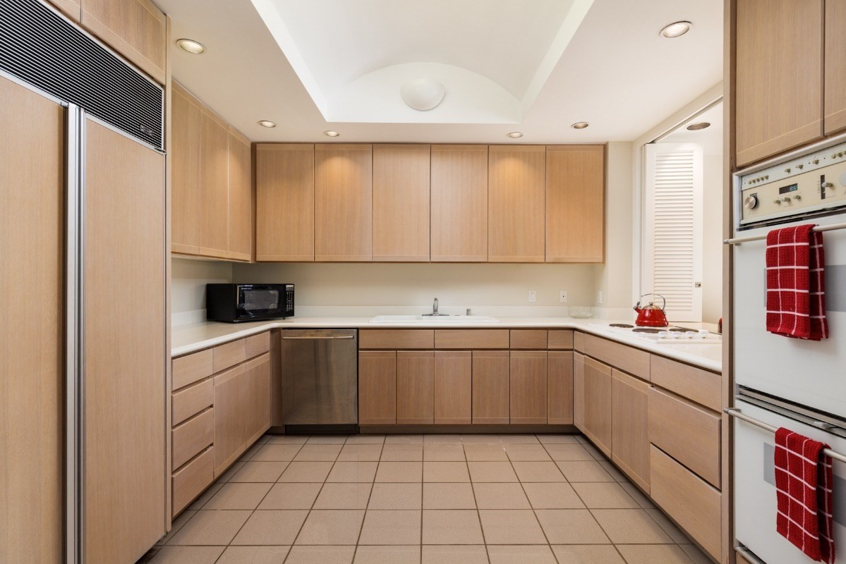 68-1375 Pauoa Road, Unit M2 Kamuela, HI 96743 - Photo 7 of 26 a kitchen with a sink a stove and cabinets