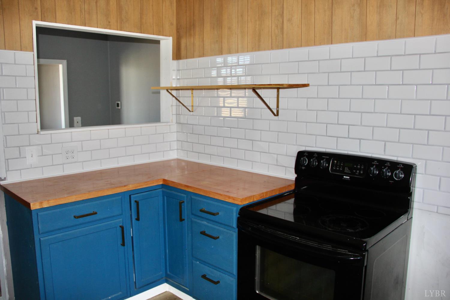 1140 Sunset Hill Road Big Island, VA 24526 - Photo 11 of 36 a kitchen with a sink and cabinets