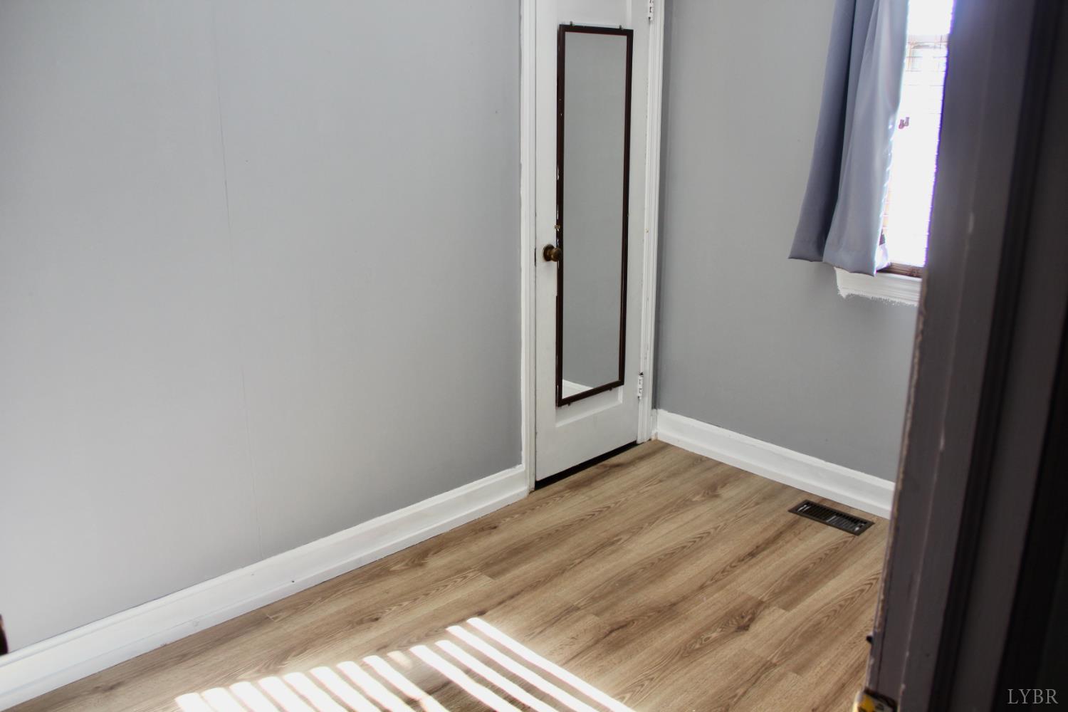 1140 Sunset Hill Road Big Island, VA 24526 - Photo 19 of 36 a view of an empty room and window