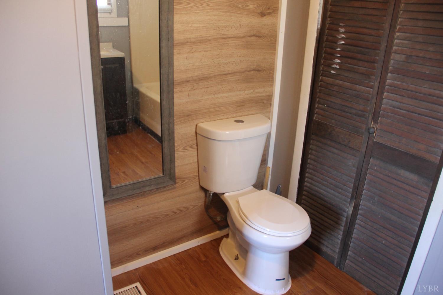 1140 Sunset Hill Road Big Island, VA 24526 - Photo 27 of 36 a white toilet sitting next to a small bathroom