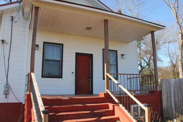 a view of a balcony with furniture