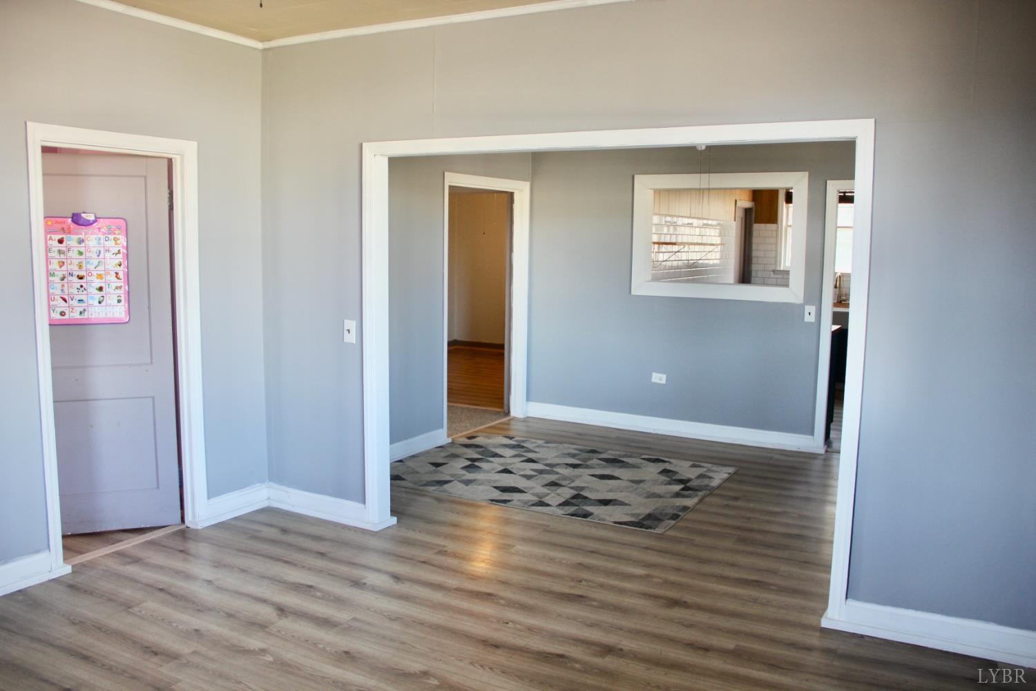 1140 Sunset Hill Road Big Island, VA 24526 - Photo 6 of 36 a view of an empty room with wooden floor and a window