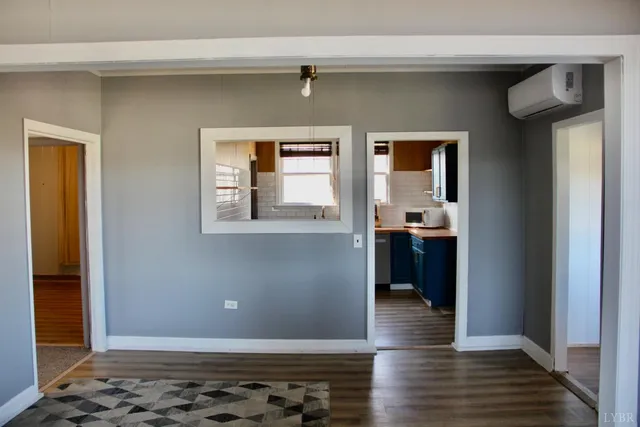 a view of a house with wooden floor and a window
