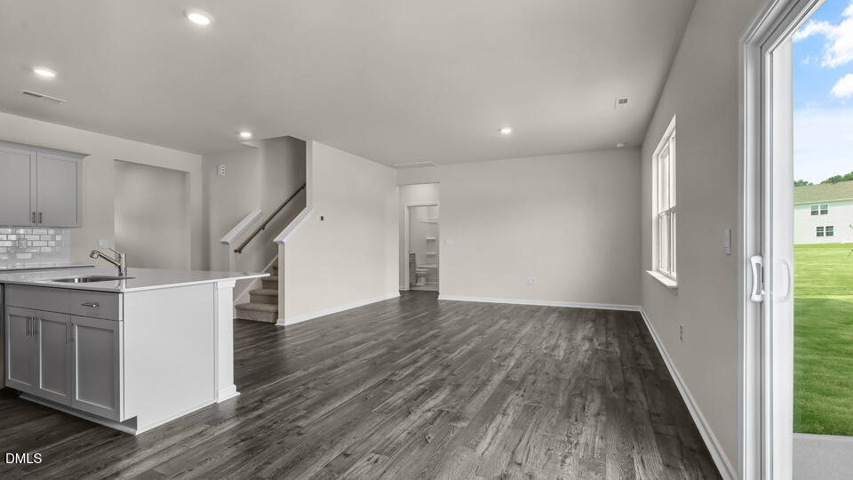 1277 Pavo Path Wendell, NC 27591 - Photo 13 of 53 a view of a kitchen with wooden floor and electronic appliances