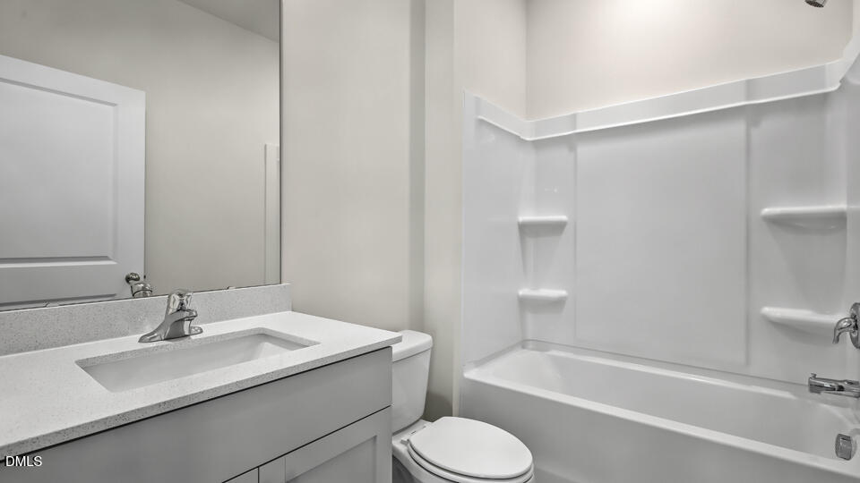 1277 Pavo Path Wendell, NC 27591 - Photo 17 of 53 a bathroom with a sink toilet and bathtub