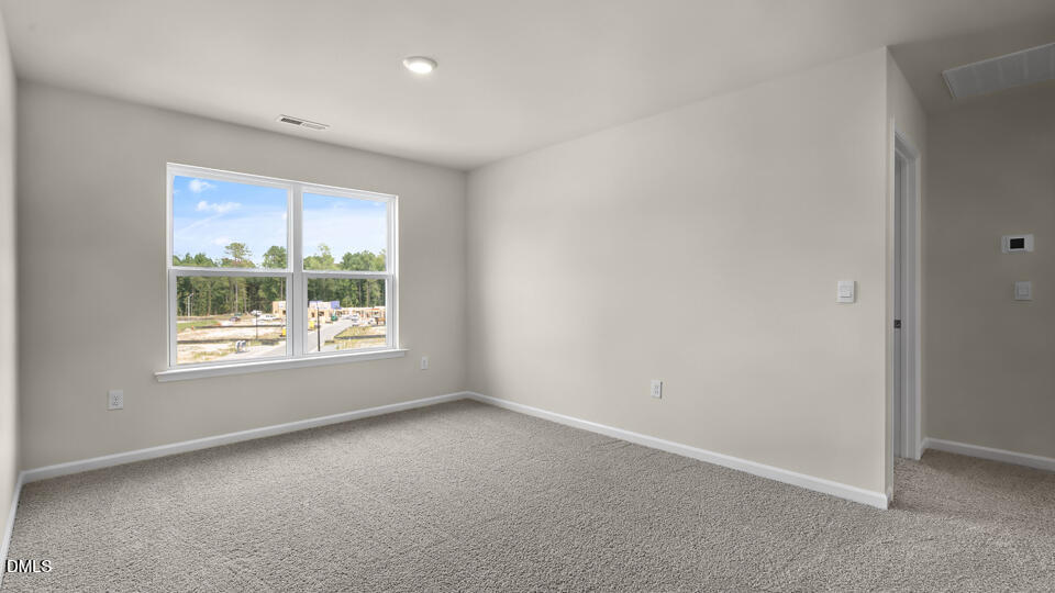 1277 Pavo Path Wendell, NC 27591 - Photo 18 of 53 an empty room with a window