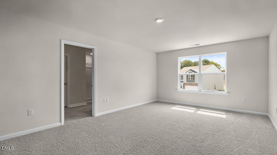 1277 Pavo Path Wendell, NC 27591 - Photo 22 of 53 an empty room with windows and closet