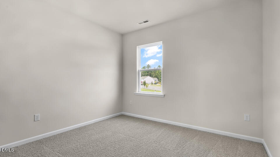1277 Pavo Path Wendell, NC 27591 - Photo 27 of 53 an empty room with windows