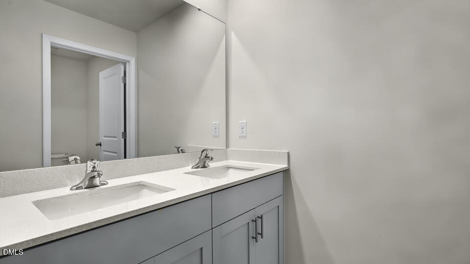 1277 Pavo Path Wendell, NC 27591 - Photo 31 of 53 a bathroom with a sink and a mirror