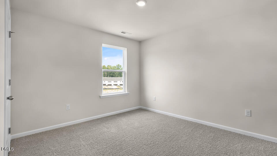 1277 Pavo Path Wendell, NC 27591 - Photo 32 of 53 an empty room with windows