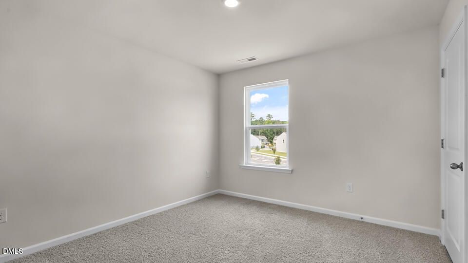 1277 Pavo Path Wendell, NC 27591 - Photo 34 of 53 an empty room with a window