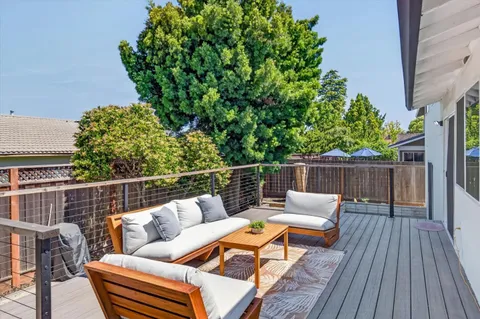a view of a deck with furniture