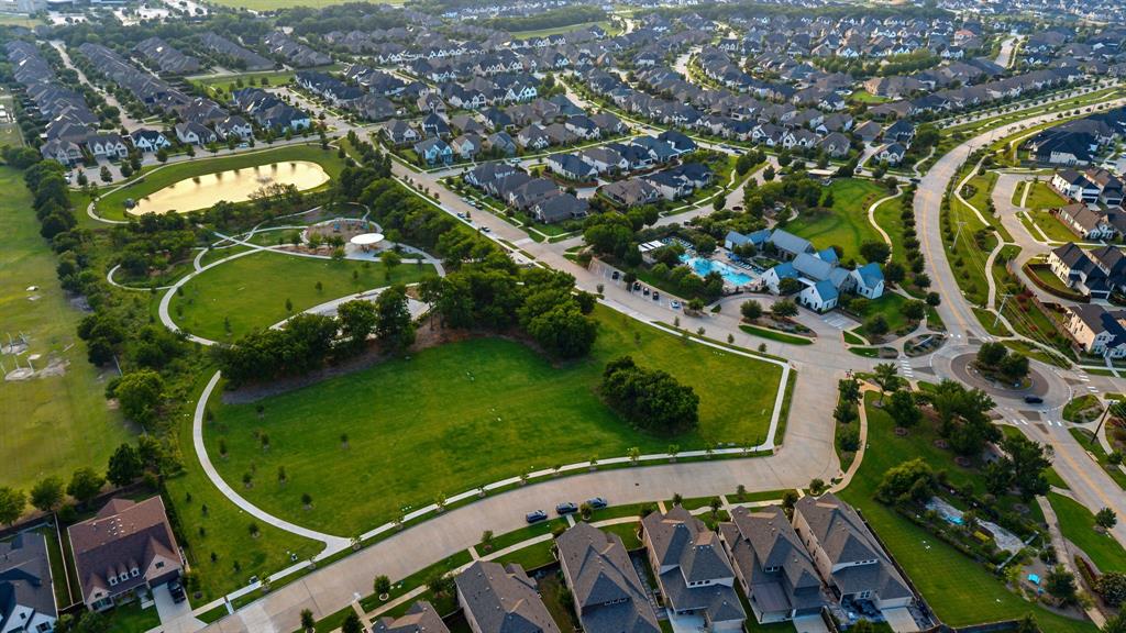 7852 Buffaloberry Road Frisco, TX 75035 - Photo 33 of 36 Aerial perspective of a sprawling residential development featuring numerous homes with dark roofs