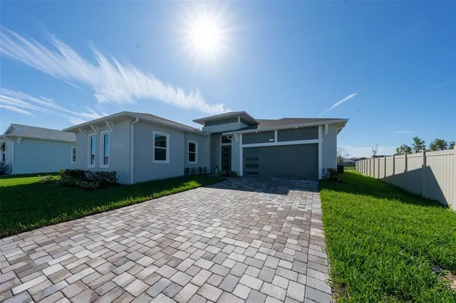 a view of house with a yard