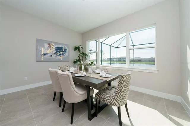a dining room with furniture and window