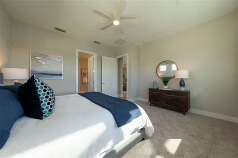 a bedroom with a bed and a mirror