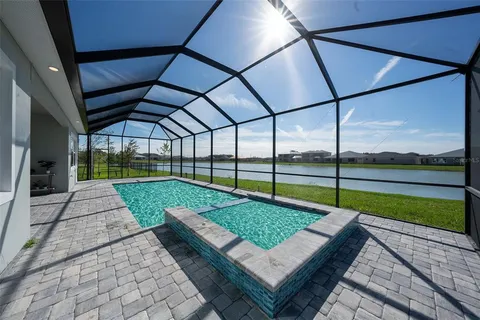 a view of a backyard with sitting area