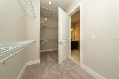 a view of an empty room with closet