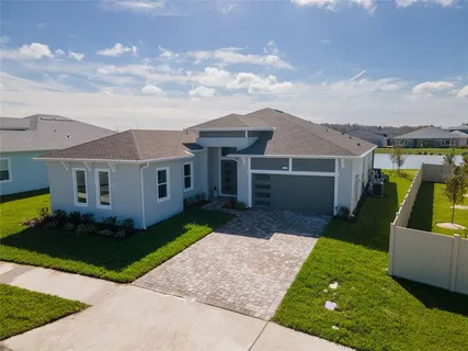 a view of a house with a back yard