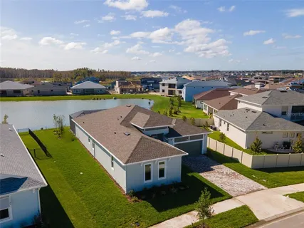 an aerial view of a house with a garden