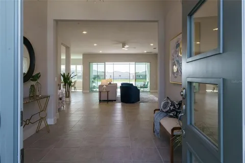 a lobby with furniture and a large window