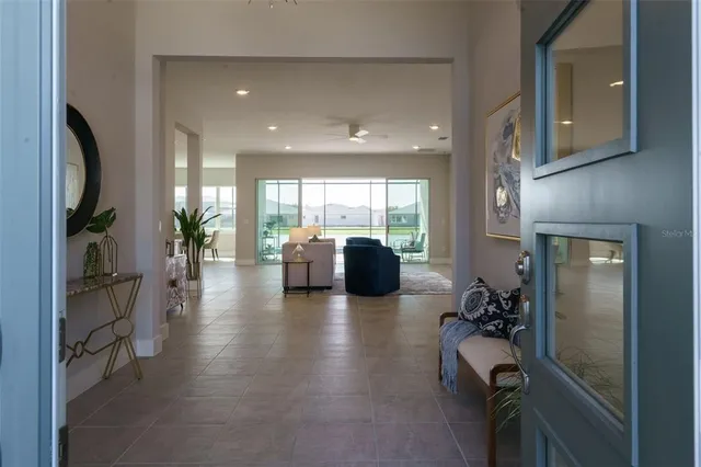 a lobby with furniture and a large window