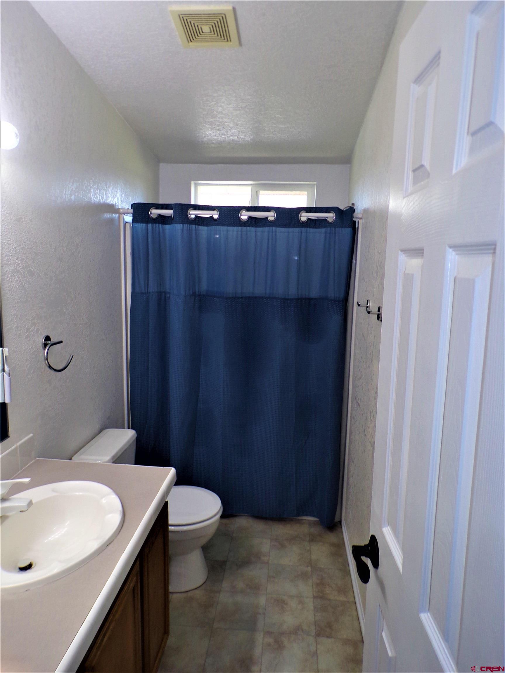 24085 Rd North Cortez, CO 81321 - Photo 15 of 34 a bathroom with a sink and a mirror