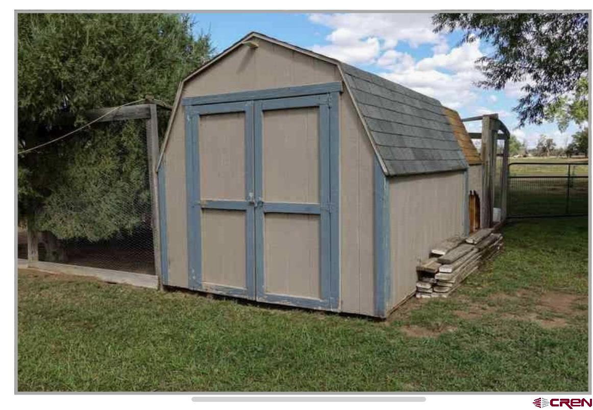 24085 Rd North Cortez, CO 81321 - Photo 20 of 34 a backyard of a house with lots of green space