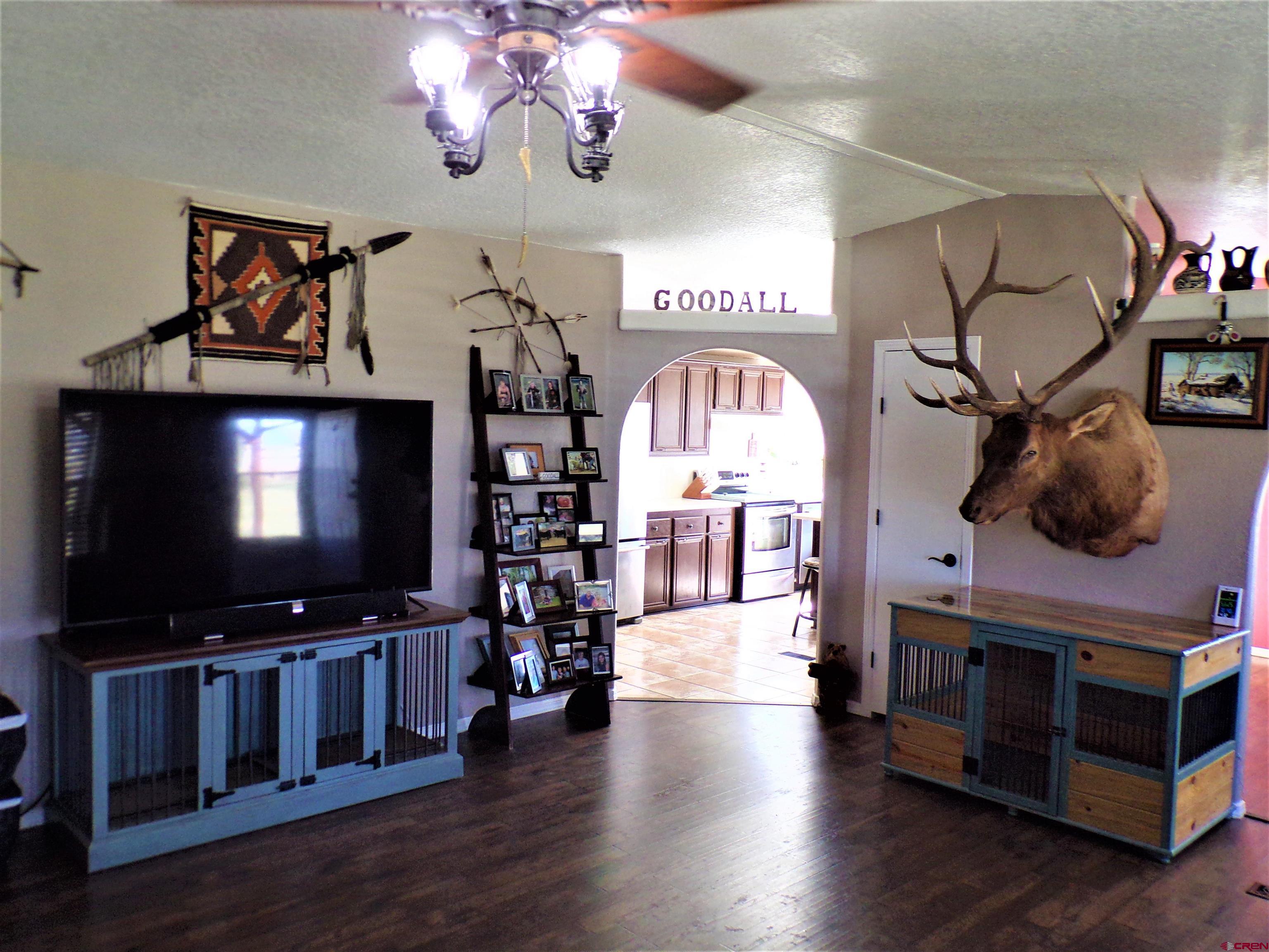 24085 Rd North Cortez, CO 81321 - Photo 5 of 34 a living room with furniture and a flat screen tv