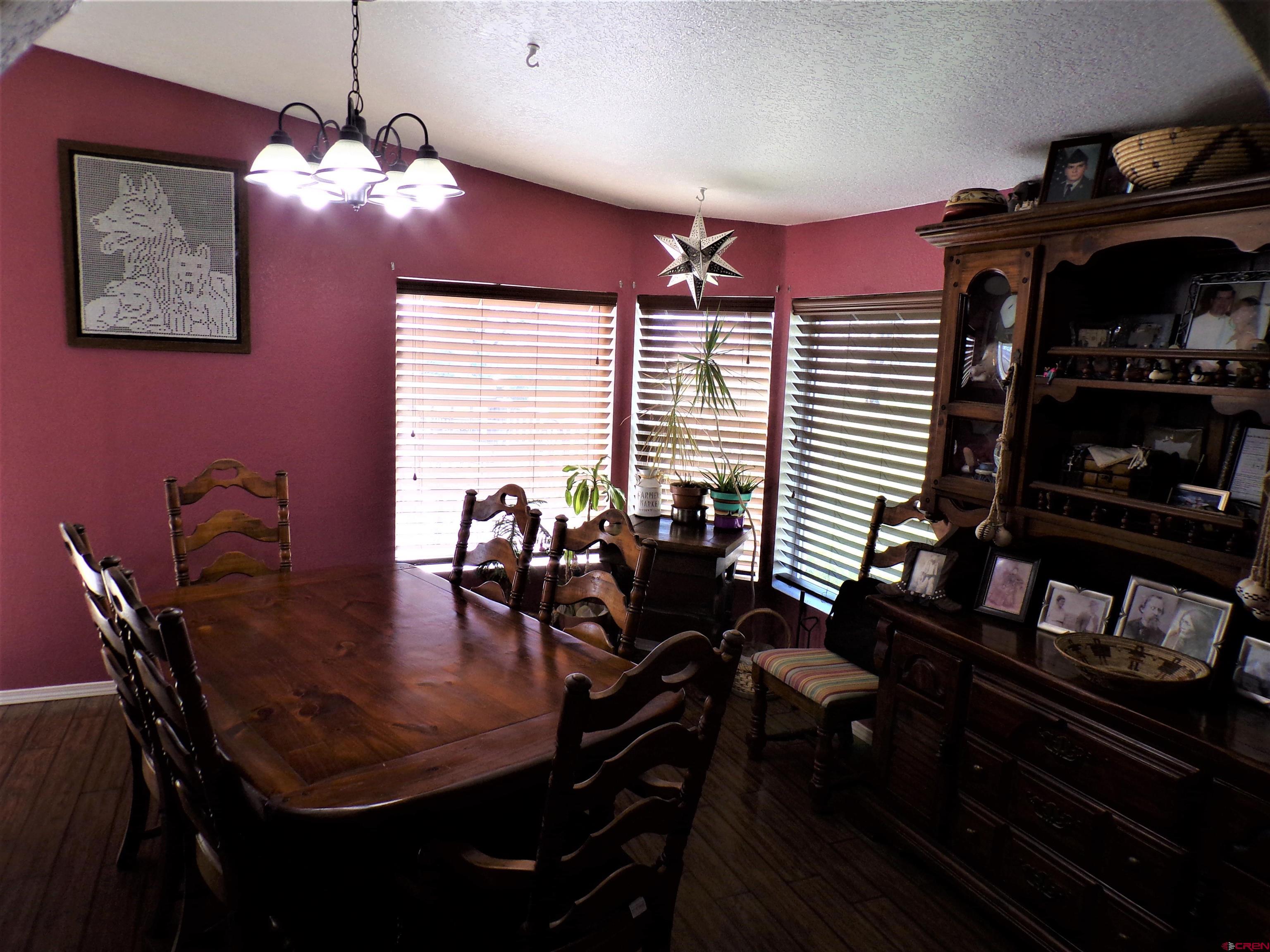24085 Rd North Cortez, CO 81321 - Photo 8 of 34 a dining room with furniture and wooden floor